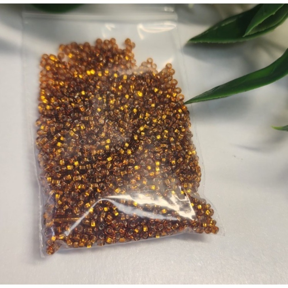 Czech Glass Beads 10/0 Preciosa Brand.  Amber Brown Crystal Color. Bag  15 Gr.